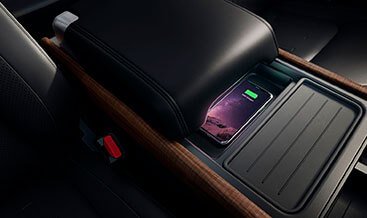 Wireless Device Charging — Qi-compatible charging pad integrated into center console